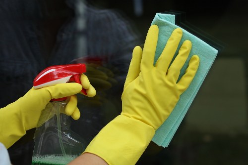 Professional oven cleaner in Shepherdsbush removing grease from a kitchen oven