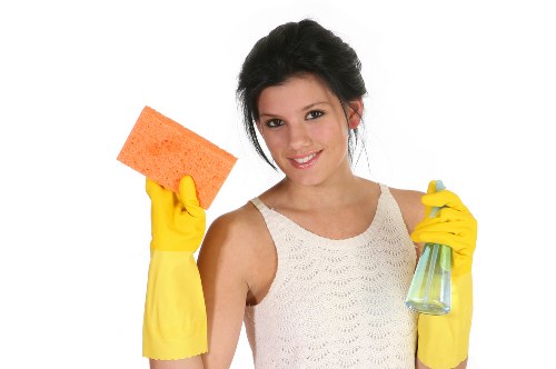 Professional carpet cleaner in Shepherdsbush deep cleaning a living room carpet