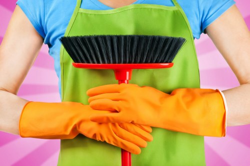 Deep oven cleaning service in Shepherdsbush with racks and trays being cleaned